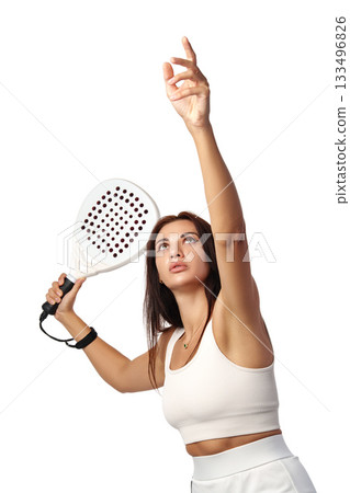 Woman prepares to serve in a paddle tennis match with focus and determination 133496826