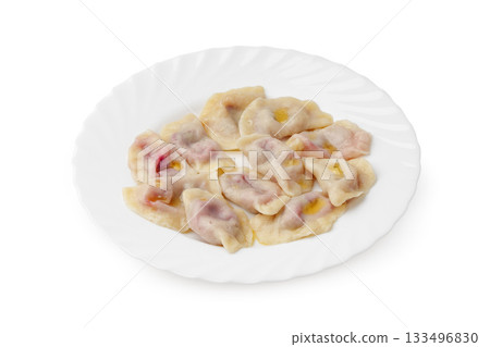 Delicious dumplings served on a white plate for a savory meal 133496830