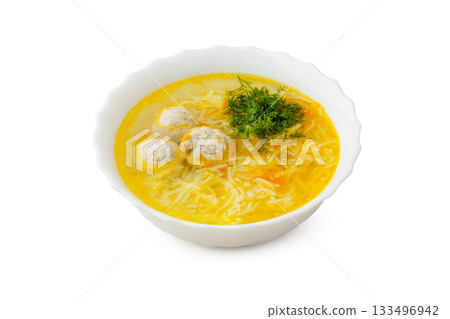 Delicious bowl of soup with meatballs and herbs on a white background Delicious bowl of soup with meatballs and herbs on a white background 133496942