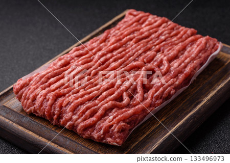 Raw ground beef or pork, fresh meat for burgers or other dishes. Raw beef minced meat Raw ground beef or pork, fresh meat for burgers or other dishes. Raw beef minced meat 133496973
