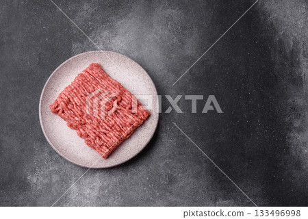Raw ground beef or pork, fresh meat for burgers or other dishes. Raw beef minced meat 133496998