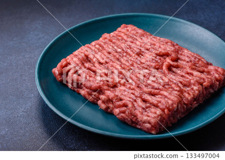 Raw ground beef or pork, fresh meat for burgers or other dishes. Raw beef minced meat 133497004