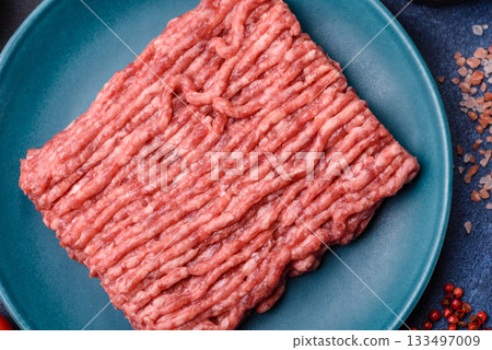 Raw ground beef or pork, fresh meat for burgers or other dishes. Raw beef minced meat 133497009