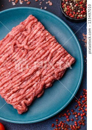 Raw ground beef or pork, fresh meat for burgers or other dishes. Raw beef minced meat Raw ground beef or pork, fresh meat for burgers or other dishes. Raw beef minced meat 133497010
