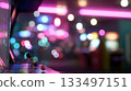 Colorful arcade filled with classic games and vibrant lights at night 133497151