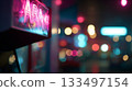 Neon sign illuminates street scene at night with colorful bokeh lights 133497154