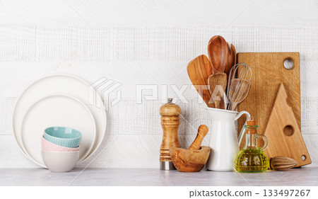 Kitchen utensils and spices on table 133497267