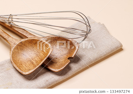 Kitchen utensils on beige table Kitchen utensils on beige table 133497274
