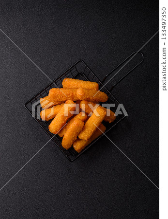 Mozzarella cheese sticks, crispy nutritious fast food. Cheese sticks as food background 133497350