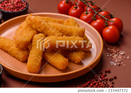 Mozzarella cheese sticks, crispy nutritious fast food. Cheese sticks as food background Mozzarella cheese sticks, crispy nutritious fast food. Cheese sticks as food background 133497372