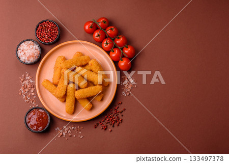 Mozzarella cheese sticks, crispy nutritious fast food. Cheese sticks as food background Mozzarella cheese sticks, crispy nutritious fast food. Cheese sticks as food background 133497378