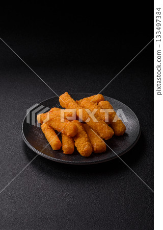 Mozzarella cheese sticks, crispy nutritious fast food. Cheese sticks as food background 133497384