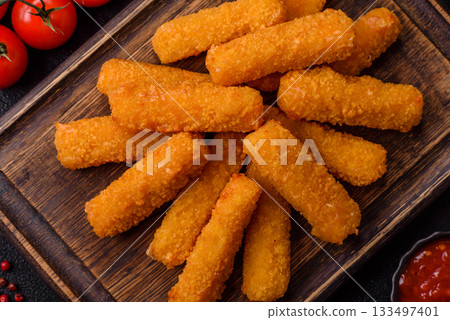 Mozzarella cheese sticks, crispy nutritious fast food. Cheese sticks as food background 133497401