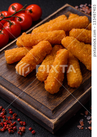 Mozzarella cheese sticks, crispy nutritious fast food. Cheese sticks as food background 133497403