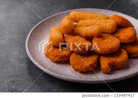 Chicken nugget with sauce, crispy nutritious fast food. Chicken nugget Chicken nugget with sauce, crispy nutritious fast food. Chicken nugget 133497417