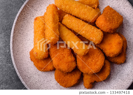 Chicken nugget with sauce, crispy nutritious fast food. Chicken nugget Chicken nugget with sauce, crispy nutritious fast food. Chicken nugget 133497418