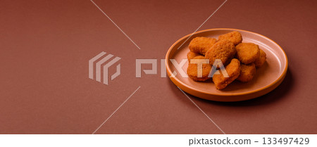 Chicken nugget with sauce, crispy nutritious fast food. Chicken nugget Chicken nugget with sauce, crispy nutritious fast food. Chicken nugget 133497429