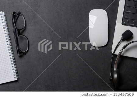 Office supplies and laptop on black leather workspace, top view with copy space Office supplies and laptop on black leather workspace, top view with copy space 133497509