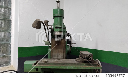 Old vintage rusty milling machine. 133497757