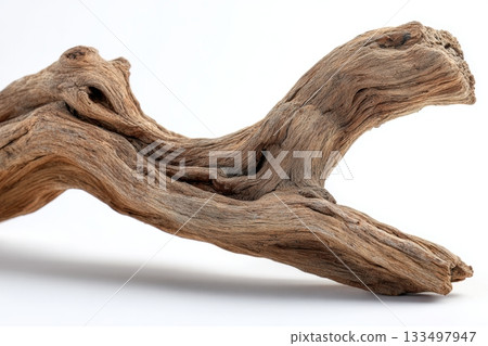 Driftwood with unique shape on a white background 133497947