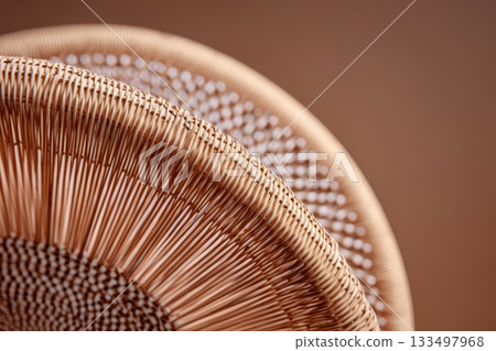 Crafted wicker chair showcasing intricate design details 133497968