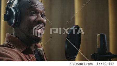 Dedicated Voice Actor Shaping Dramatic Lines For Film Dubbing 133498452