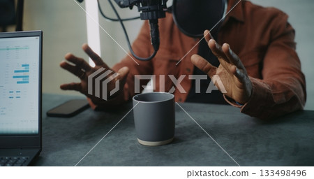Expressive Male Hands Gesturing While Discussing Ideas in Podcast Studio Expressive Male Hands Gesturing While Discussing Ideas in Podcast Studio 133498496
