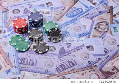 Casino game in the United Arab Emirates, dirham, chips, cards. Gambling in casinos in the Emirates 133498610