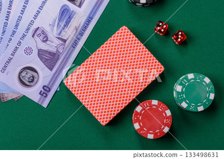 Casino game in the United Arab Emirates, dirham, chips, cards. Gambling in casinos in the Emirates 133498631