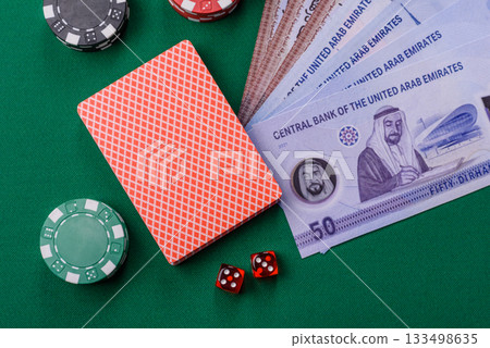 Casino game in the United Arab Emirates, dirham, chips, cards. Gambling in casinos in the Emirates 133498635