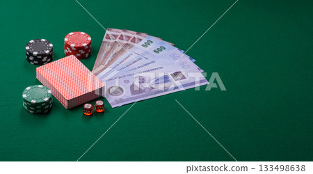 Casino game in the United Arab Emirates, dirham, chips, cards. Gambling in casinos in the Emirates Casino game in the United Arab Emirates, dirham, chips, cards. Gambling in casinos in the Emirates 133498638
