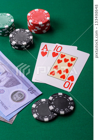 Casino game in the United Arab Emirates, dirham, chips, cards. Gambling in casinos in the Emirates Casino game in the United Arab Emirates, dirham, chips, cards. Gambling in casinos in the Emirates 133498648