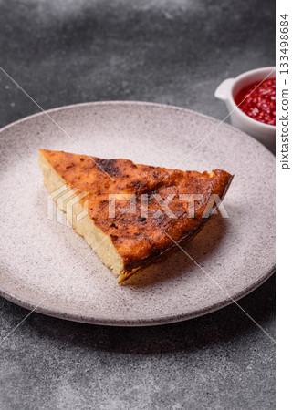 Cake, cheesecake sweet dessert, slice of delicious sweetness on a plate. Piece of cheesecake Cake, cheesecake sweet dessert, slice of delicious sweetness on a plate. Piece of cheesecake 133498684