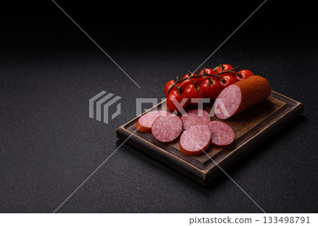 Sliced salami sausage, smoked dry meat as food background. Salami sausage 133498791