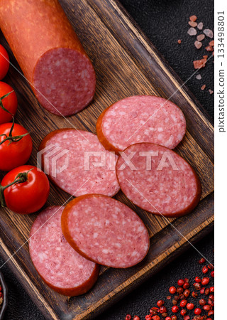 Sliced salami sausage, smoked dry meat as food background. Sliced salami Sliced salami sausage, smoked dry meat as food background. Sliced salami 133498801