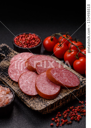 Sliced salami sausage, smoked dry meat as food background. Sliced salami Sliced salami sausage, smoked dry meat as food background. Sliced salami 133498818