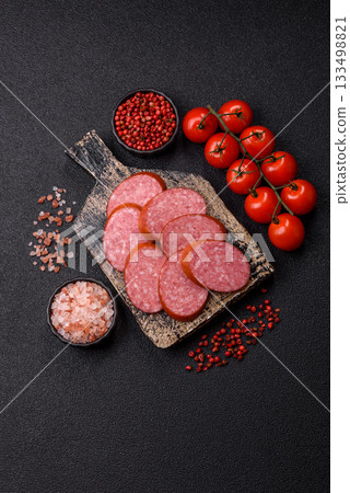 Sliced salami sausage, smoked dry meat as food background. Sliced salami Sliced salami sausage, smoked dry meat as food background. Sliced salami 133498821