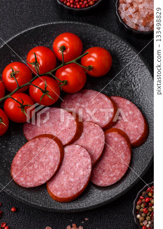 Sliced salami sausage, smoked dry meat as food background. Sliced salami 133498829