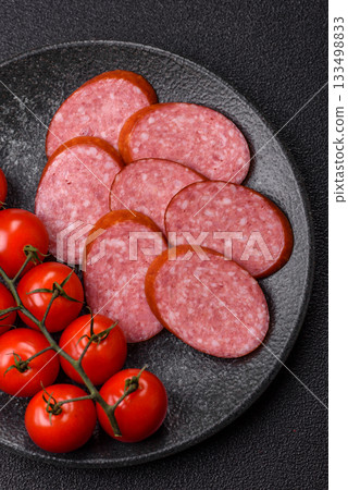 Sliced salami sausage, smoked dry meat as food background. Sliced salami Sliced salami sausage, smoked dry meat as food background. Sliced salami 133498833