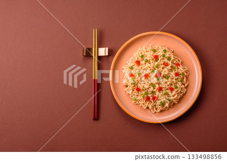 Asian food, chinese or thai rice noodles with vegetables and meat. Rice noodles Asian food, chinese or thai rice noodles with vegetables and meat. Rice noodles 133498856