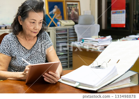 Grandma works at home 133498878