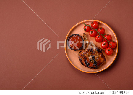 Steak, beef or pork on the bone, meat cooked on the grill with rosemary. Steak on the bone Steak, beef or pork on the bone, meat cooked on the grill with rosemary. Steak on the bone 133499294