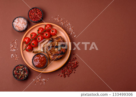 Steak, beef or pork on the bone, meat cooked on the grill with rosemary. Steak on the bone 133499306