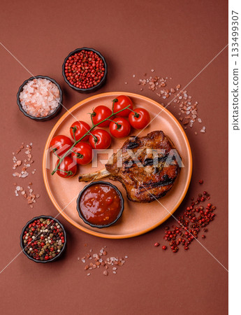 Steak, beef or pork on the bone, meat cooked on the grill with rosemary. Steak on the bone Steak, beef or pork on the bone, meat cooked on the grill with rosemary. Steak on the bone 133499307