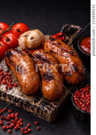 Grilled chicken or beef sausages with sauce and spices. Grilled sausages Grilled chicken or beef sausages with sauce and spices. Grilled sausages 133499332