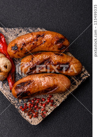 Grilled chicken or beef sausages with sauce and spices. Grilled sausages Grilled chicken or beef sausages with sauce and spices. Grilled sausages 133499335