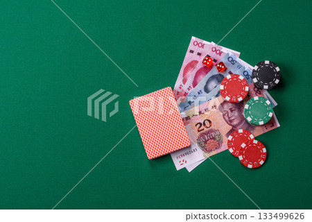 Casino game in the China, yuan money, chips, cards. Gambling in casinos in the China 133499626