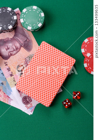 Casino game in the China, yuan money, chips, cards. Gambling in casinos in the China Casino game in the China, yuan money, chips, cards. Gambling in casinos in the China 133499635