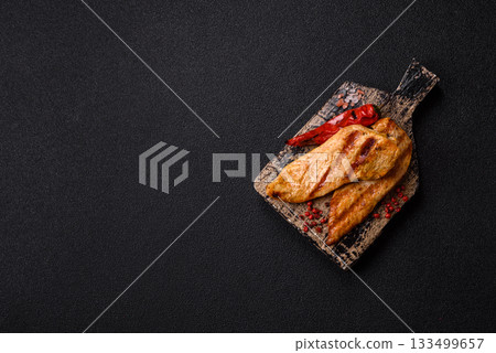 Grilled chicken or turkey breast, a healthy lunch option. Grilled chicken steak Grilled chicken or turkey breast, a healthy lunch option. Grilled chicken steak 133499657