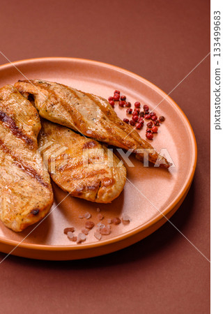 Grilled chicken or turkey breast, a healthy lunch option. Grilled chicken steak Grilled chicken or turkey breast, a healthy lunch option. Grilled chicken steak 133499683